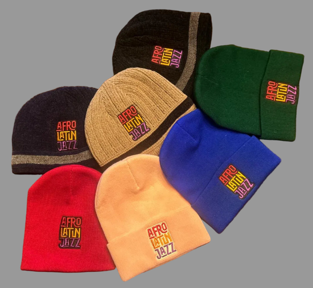 Collection of colorful beanies with 'Afro Latin Jazz' text 
